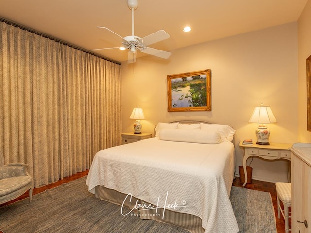 bedroom with ceiling fan and dark wood-type flooring