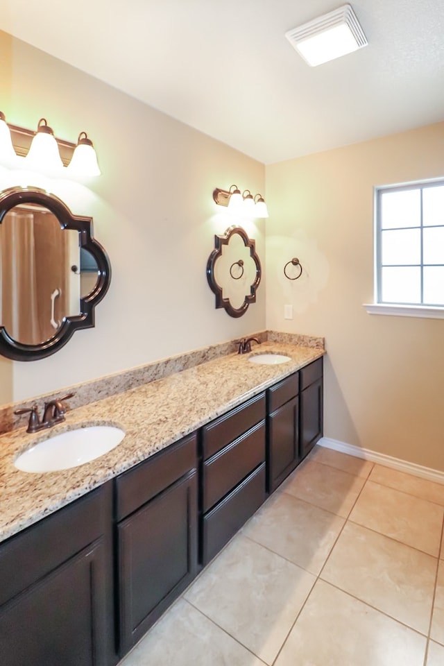 bathroom with vanity and tile patterned floors