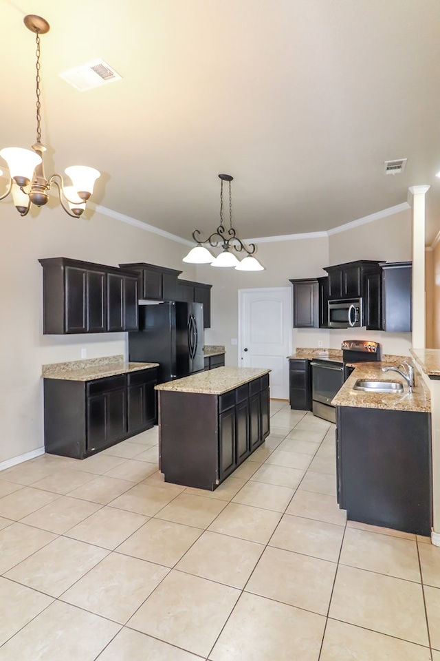 kitchen featuring sink, a center island, light tile patterned floors, pendant lighting, and stainless steel appliances