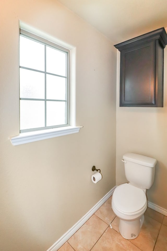 bathroom with tile patterned flooring and toilet