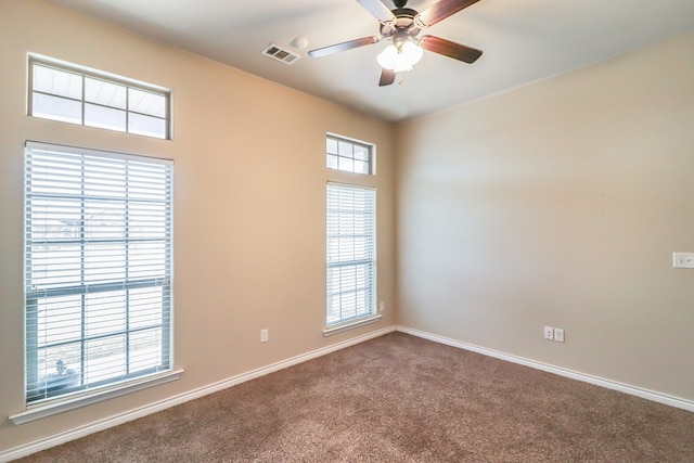 carpeted empty room with ceiling fan