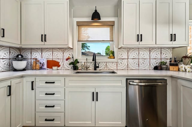 2401 Metz Pl, Midland, TX 79705 - kitchen featuring dishwasher, a sink, light countertops, and white cabinets