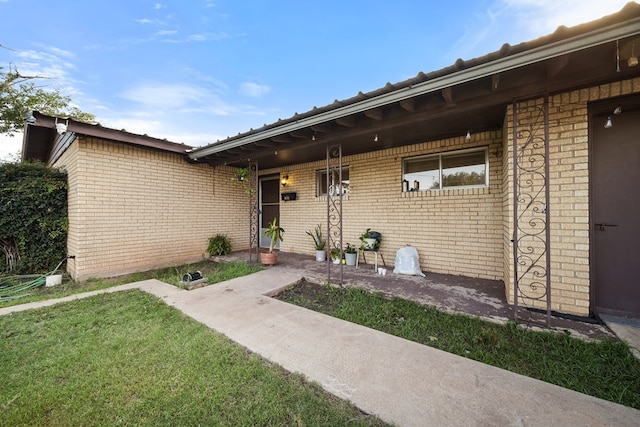 704 Birdwell Ln, Big Spring, TX 79720 - entrance to property with brick siding and a lawn