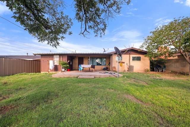 704 Birdwell Ln, Big Spring, TX 79720 - rear view of house with a patio area and brick siding