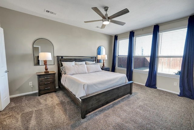 bedroom featuring ceiling fan and dark carpet