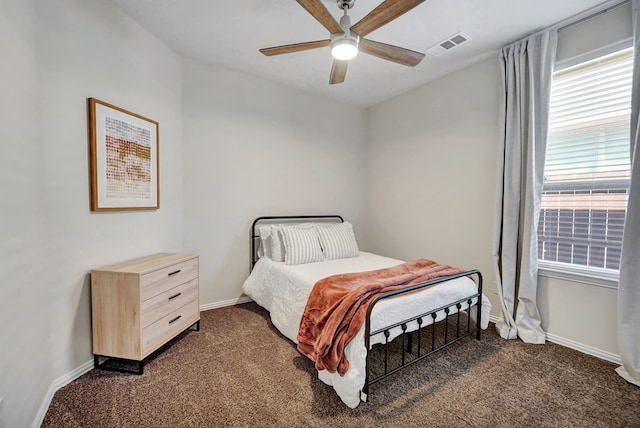 bedroom featuring dark colored carpet and ceiling fan