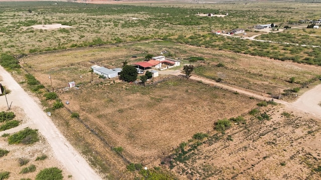 birds eye view of property with a rural view