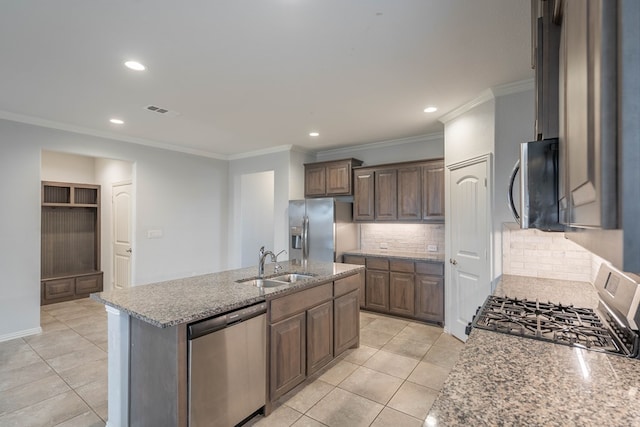 1215 Santa Clara, Midland, TX 79705 - kitchen with appliances with stainless steel finishes, a sink, ornamental molding, recessed lighting, and decorative backsplash