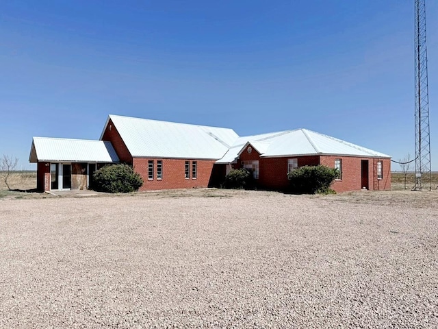 view of side of property with metal roof