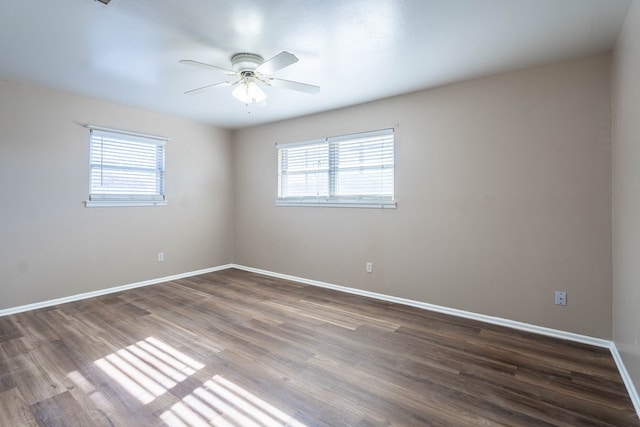 unfurnished room with dark hardwood / wood-style floors and ceiling fan