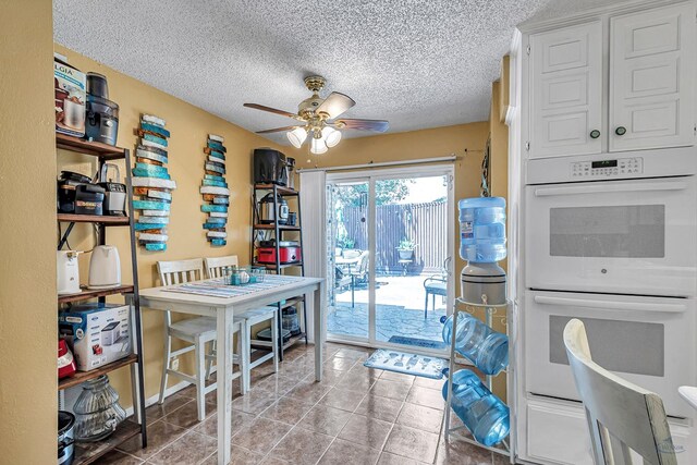3409 Wedgwood, Midland, TX 79707 - tiled dining space with a textured ceiling and ceiling fan