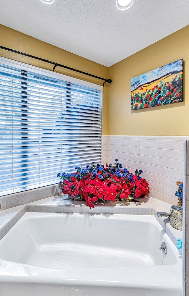 3409 Wedgwood, Midland, TX 79707 - bathroom with a textured ceiling and a garden tub