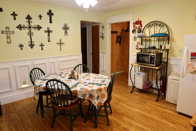 dining area with light hardwood / wood-style flooring