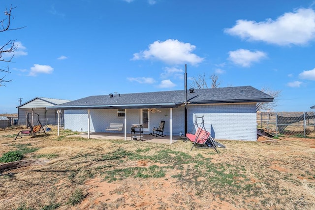 back of property featuring a patio