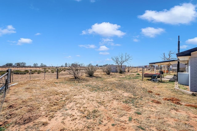 view of yard with a rural view