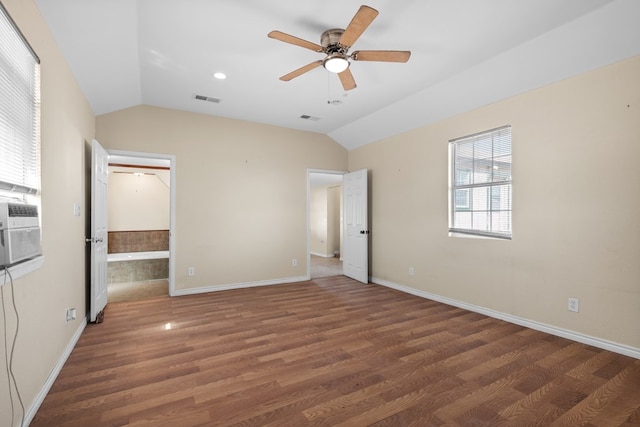 15103 E County Rd 106, Midland, TX 79706 - unfurnished bedroom featuring vaulted ceiling, wood finished floors, and a ceiling fan