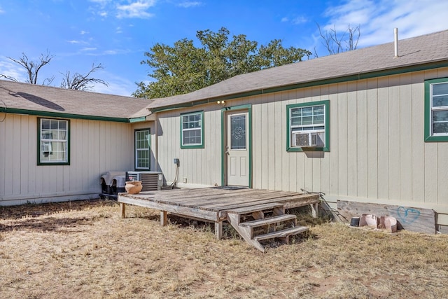 back of property featuring cooling unit and a deck