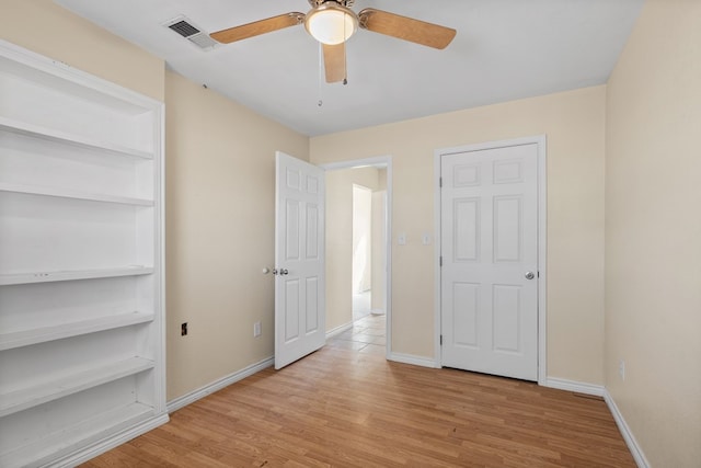 unfurnished bedroom featuring ceiling fan and light hardwood / wood-style floors