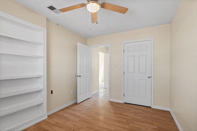 15103 E County Rd 106, Midland, TX 79706 - unfurnished bedroom with light wood-type flooring and ceiling fan