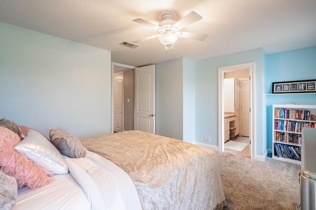 4508 Island Dr, Midland, TX 79707 - bedroom featuring carpet, baseboards, ceiling fan, and ensuite bath