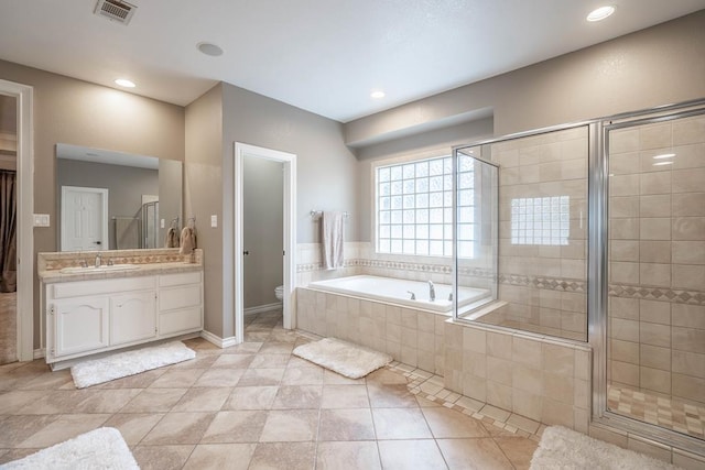 4508 Island Dr, Midland, TX 79707 - full bath with a shower stall, a garden tub, vanity, toilet, and recessed lighting
