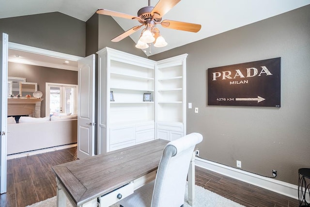 4508 Island Dr, Midland, TX 79707 - office featuring wood finished floors, ceiling fan, vaulted ceiling, baseboards, and a fireplace