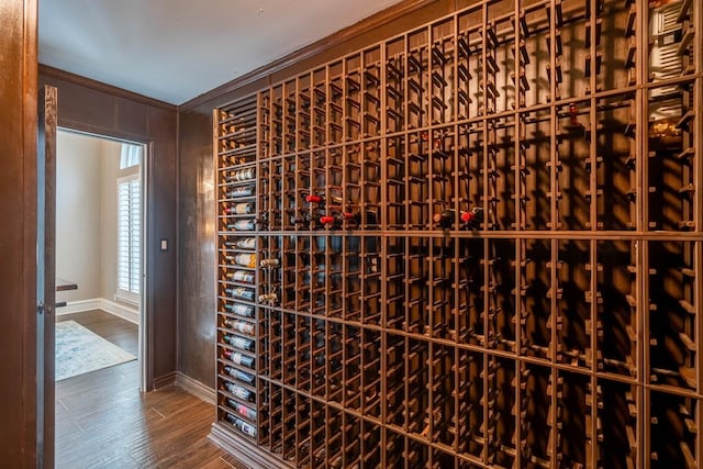 4508 Island Dr, Midland, TX 79707 - wine room featuring ornamental molding, baseboards, and wood finished floors