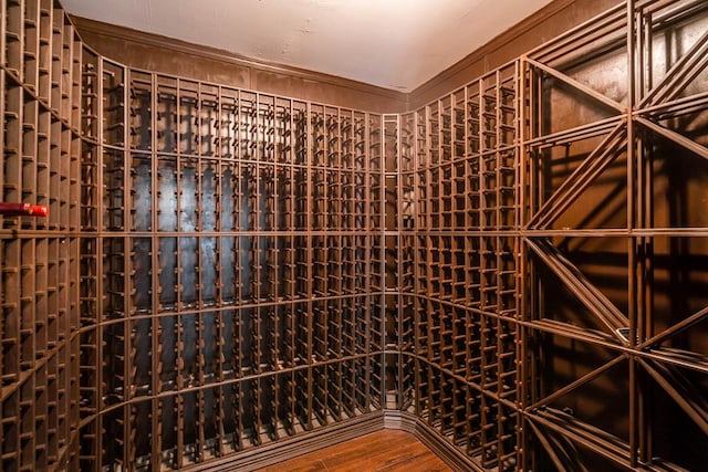 4508 Island Dr, Midland, TX 79707 - wine cellar featuring wood finished floors and crown molding