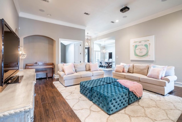 4508 Island Dr, Midland, TX 79707 - living area featuring a chandelier, wood finished floors, ornamental molding, recessed lighting, and baseboards