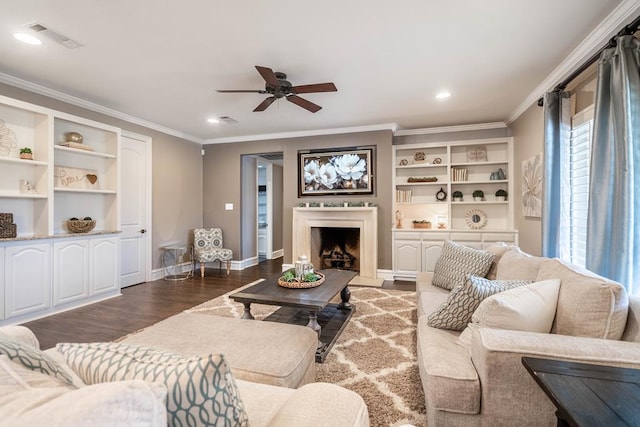 4508 Island Dr, Midland, TX 79707 - living area featuring ceiling fan, dark wood-style floors, crown molding, baseboards, and a fireplace