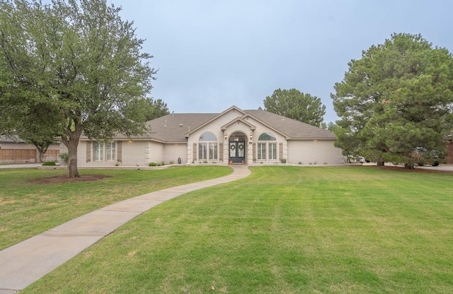 4508 Island Dr, Midland, TX 79707 - view of front facade featuring french doors and a front lawn