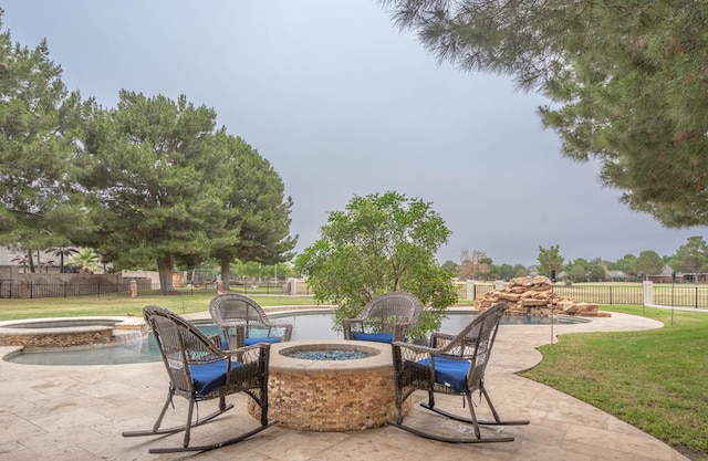4508 Island Dr, Midland, TX 79707 - view of patio / terrace with an in-ground hot tub and a fire pit
