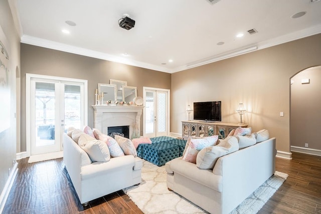 4508 Island Dr, Midland, TX 79707 - living area featuring arched walkways, ornamental molding, dark wood-style flooring, baseboards, and a high end fireplace