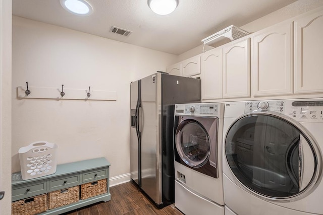 4508 Island Dr, Midland, TX 79707 - laundry area featuring washing machine and clothes dryer, dark wood-style floors, baseboards, and cabinet space