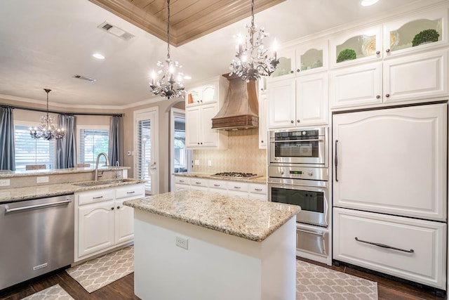 4508 Island Dr, Midland, TX 79707 - kitchen featuring stainless steel appliances, a sink, a chandelier, premium range hood, and a warming drawer