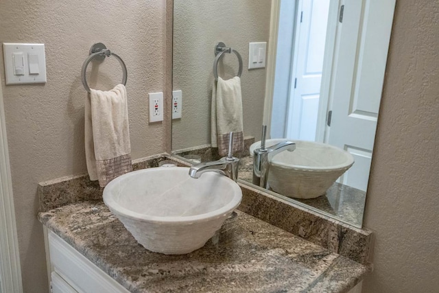 4508 Island Dr, Midland, TX 79707 - bathroom with a textured wall and vanity