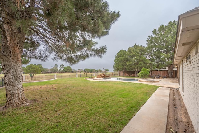 4508 Island Dr, Midland, TX 79707 - view of yard with a patio and a pool with connected hot tub