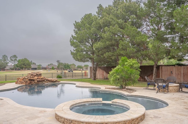 4508 Island Dr, Midland, TX 79707 - view of pool featuring a patio, a pool with connected hot tub, and a fenced backyard