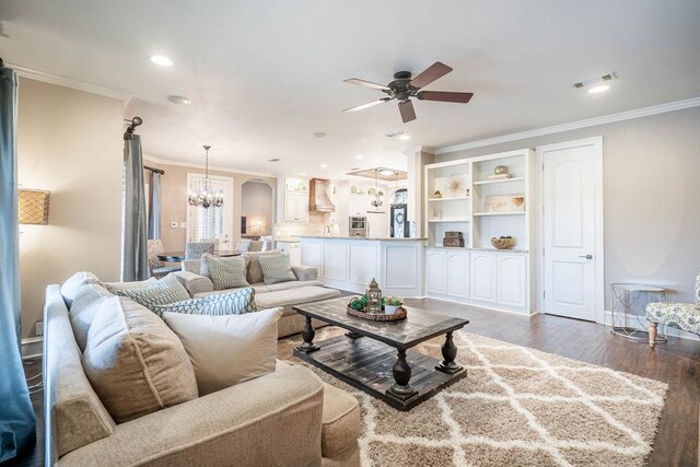 4508 Island Dr, Midland, TX 79707 - living area with a chandelier, a ceiling fan, crown molding, wood finished floors, and recessed lighting