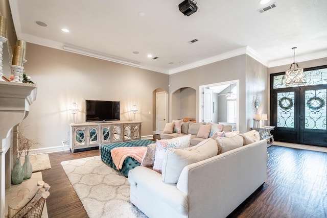 4508 Island Dr, Midland, TX 79707 - living room featuring baseboards, french doors, arched walkways, recessed lighting, and crown molding
