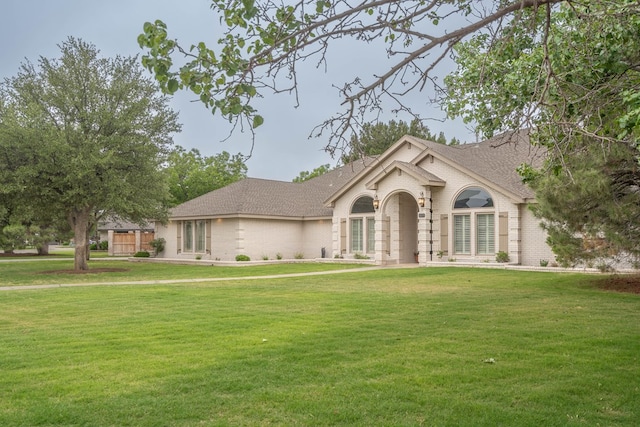 4508 Island Dr, Midland, TX 79707 - ranch-style home featuring a front yard, brick siding, and a shingled roof