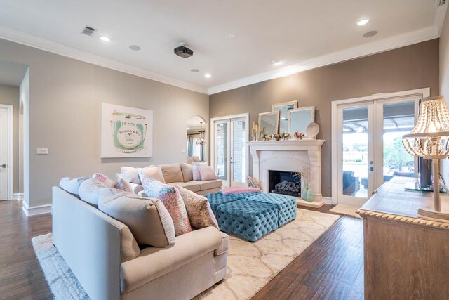 4508 Island Dr, Midland, TX 79707 - living room featuring french doors, ornamental molding, dark wood finished floors, recessed lighting, and baseboards