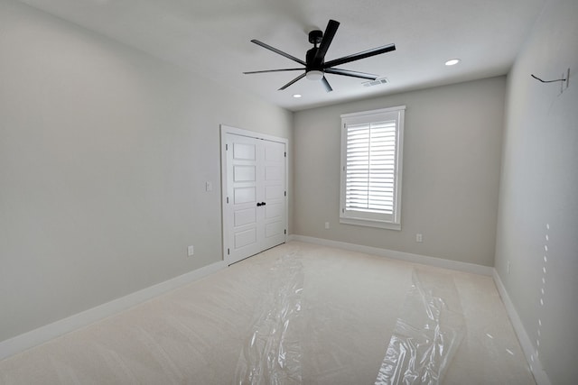 unfurnished bedroom featuring ceiling fan