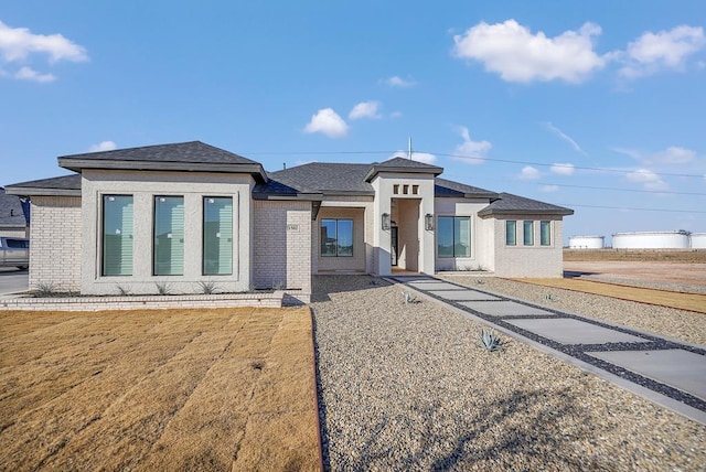 1502 S County Rd 1134, Midland, TX 79706 - prairie-style home with brick siding and a shingled roof