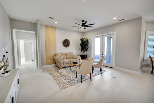 living room with french doors and ceiling fan