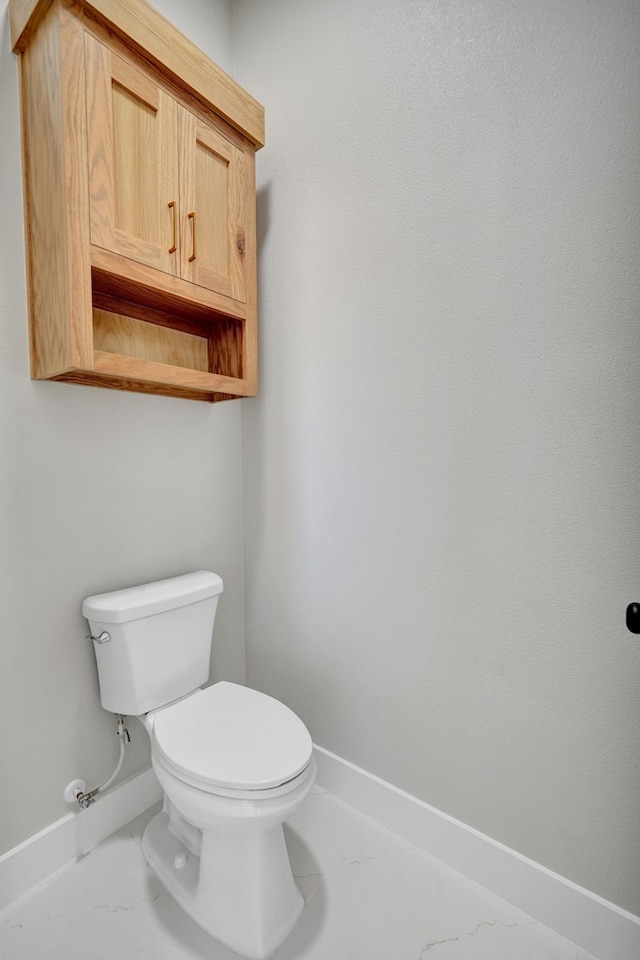 bathroom featuring toilet