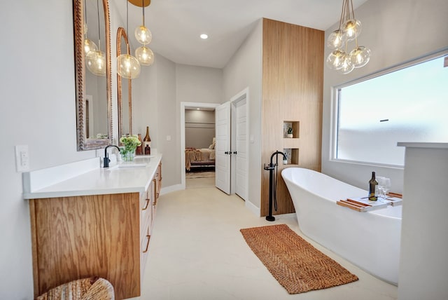 bathroom with vanity and a bathtub