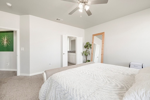 9 Senita Ct, Odessa, TX 79765 - bedroom with carpet floors, baseboards, ensuite bath, and ceiling fan