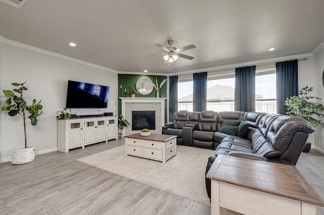9 Senita Ct, Odessa, TX 79765 - living room featuring ceiling fan, light wood-style floors, crown molding, baseboards, and recessed lighting