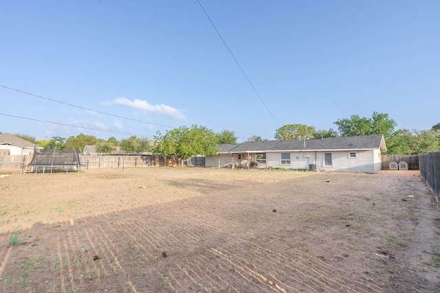 807 Boyd Ave, Midland, TX 79705 - view of yard with a fenced backyard and a trampoline